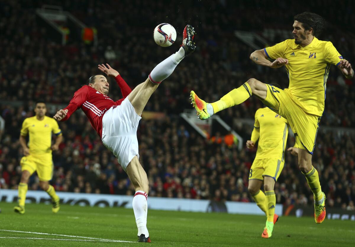 United's Zlatan Ibrahimovic goes for the ball with Rostov's Cesar Navas, right, during the Europa League round of 16, second leg, soccer match between Manchester United and FC Rostov at Old Trafford Stadium in Manchester, England, Thursday March 16, 2017. (AP Photo/Dave Thompson)