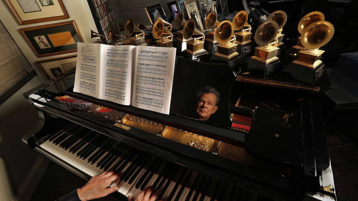 Foster's piano top holds his 16 Grammy Awards.