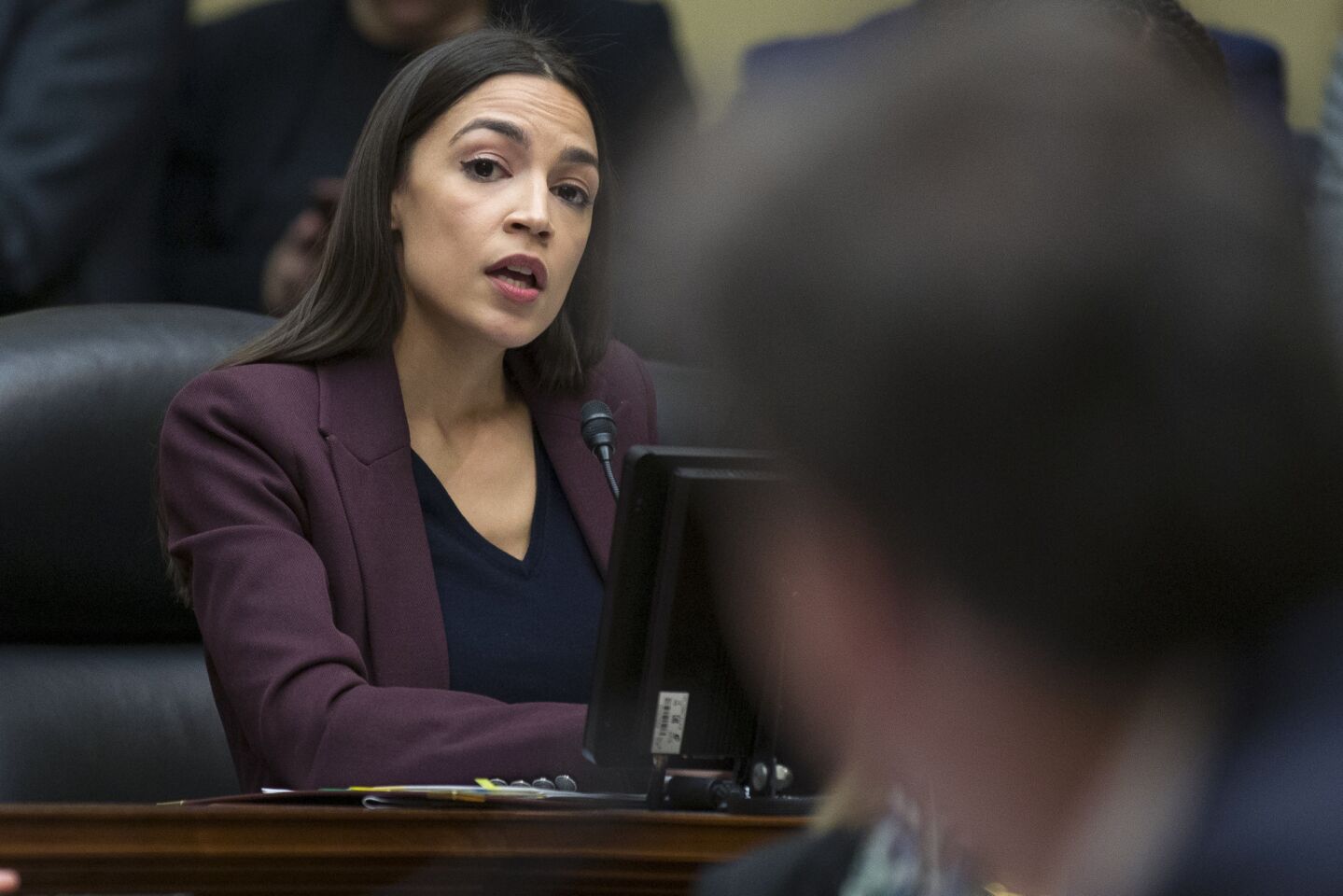 Rep. Alexandria Ocasio-Cortez, (D-N.Y.) questions Michael Cohen as he testifies before the House Oversight and Reform Committee.
