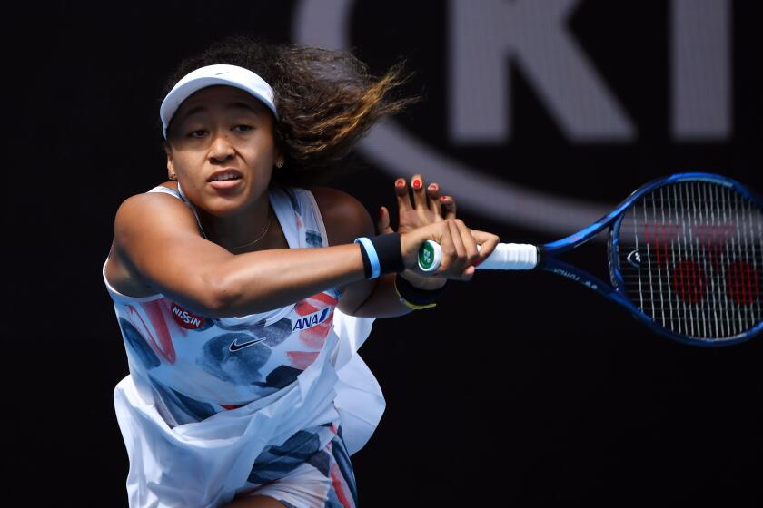 Japan's Naomi Osaka hits a return against China's Zheng Saisai during their women's singles match on day three of the Australian Open tennis tournament in Melbourne on January 22, 2020. (Photo by John DONEGAN / AFP) / IMAGE RESTRICTED TO EDITORIAL USE - STRICTLY NO COMMERCIAL USE (Photo by JOHN DONEGAN/AFP via Getty Images)