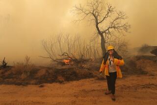 Californian reporter Ishani Desai flashes a toothy grin and a thumbs up on Aug. 19, 2021 as she covers her first ever wildfire, called the French Fire, in the Kern River Valley.