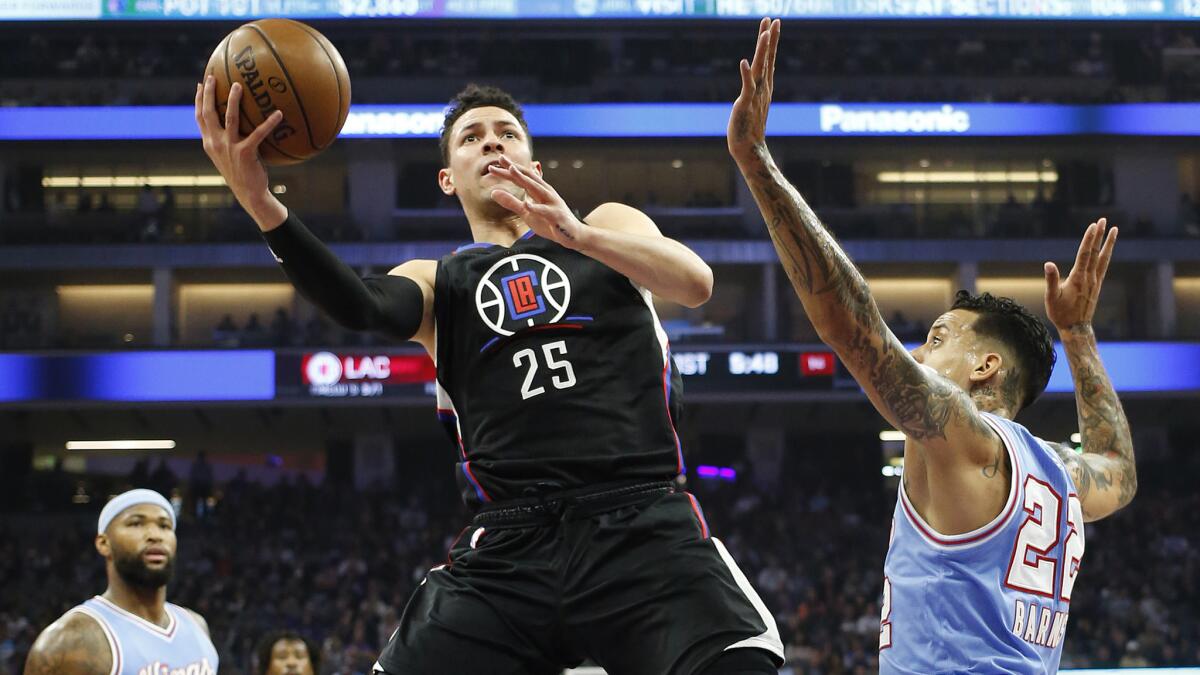 Clippers guard Austin Rivers drives to the basket against the Kings on Friday night.