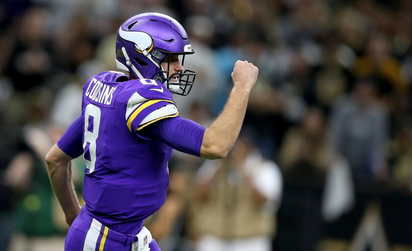 Minnesota Vikings quarterback Kirk Cousins reacts during the first half of a 26-20 overtime victory over the New Orleans Saints.