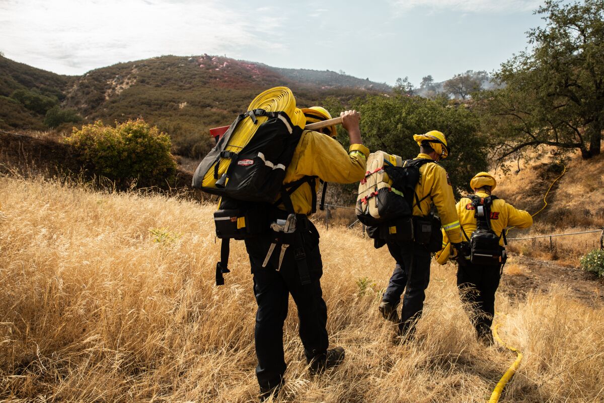 Cal Fire Firefighters make their way to construct a containment line to keep the Casner Fire from spreading.