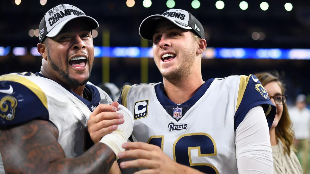 Rams guard Rodger Saffold, left, and quarterback Jared Goff celebrate after defeating the Lions at Ford Field in Detroit on Dec. 2, 2018.