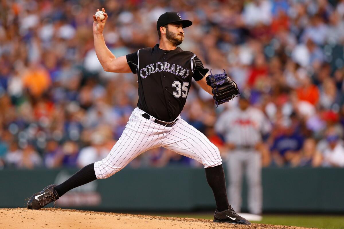 Rockies starter Chad Bettis delivers to home plate during the fourth inning against the Braves at Coors Field on Aug. 14.