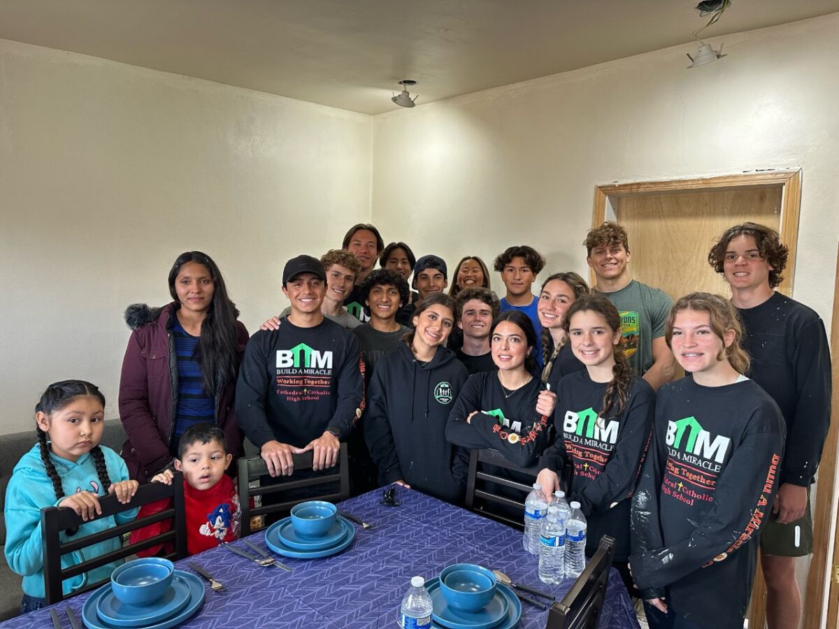 A team from Cathedral Catholic traveled to Tijuana to put the finishing touches on a house.