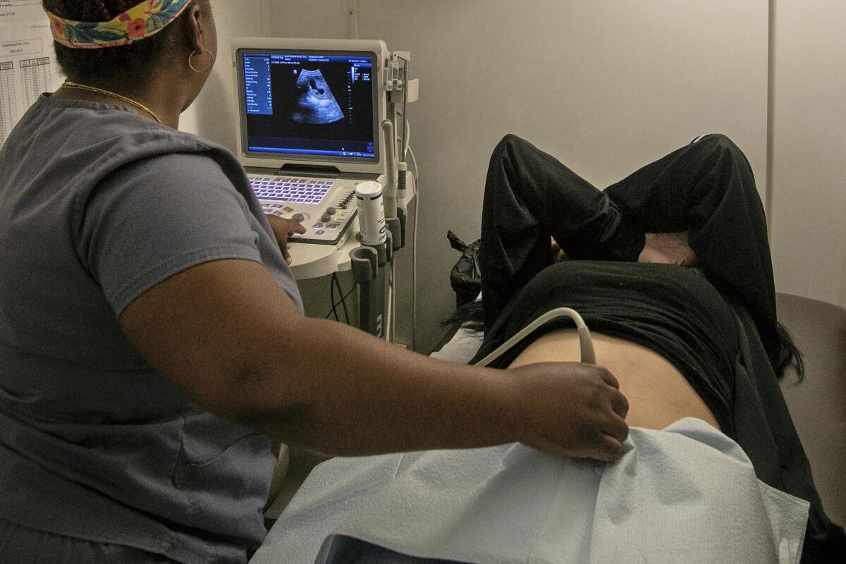FILE - An operating room technician performs an ultrasound on a patient at an abortion clinic in Shreveport, La., Wednesday, July 6, 2022. The abortion bans taking effect after the nation's highest court overturned Roe v. Wade in June 2022 vary greatly in how they define when a pregnancy can be ended. (AP Photo/Ted Jackson)