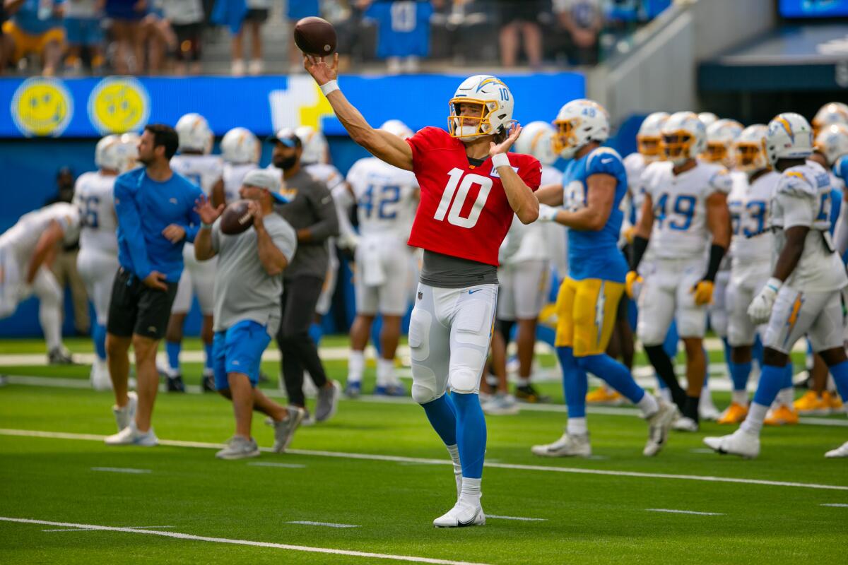 Chargers quarterback Justin Herbert throws a pass during a practice session at SoFi Stadium on Aug. 8.