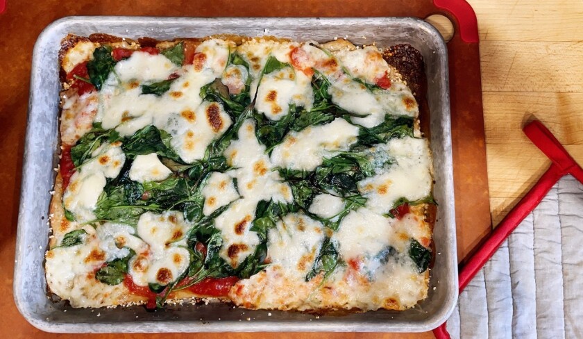 This Jan. 7, 2021 photo shows a sheet-pan pizza, a fun meal to make with kids. (Elizabeth Karmel via AP)