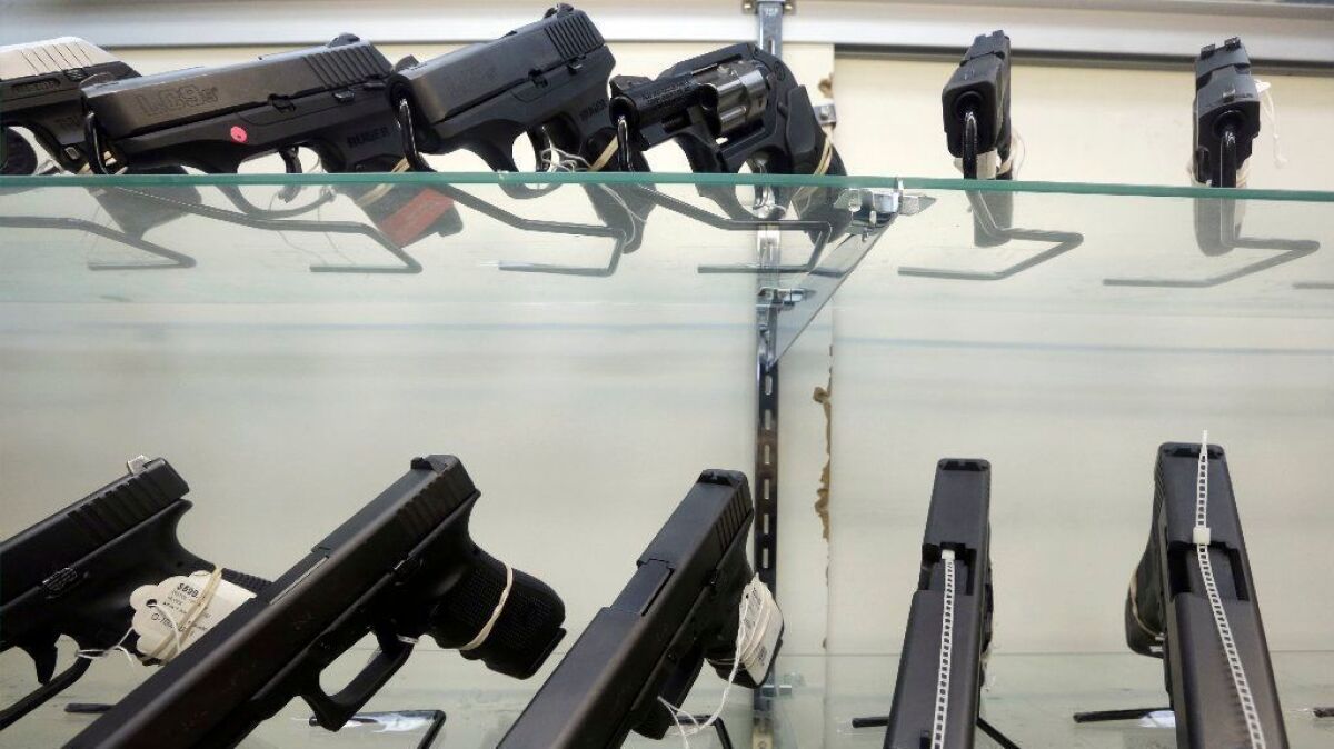 Handguns for sale are displayed at a Miami gun store in 2016.