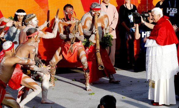 Pope Benedict XVI, right, watches a group of aboriginal dancers perform as he arrives at Bangaroo for his official World Youth Day welcome in Sydney, Australia.
