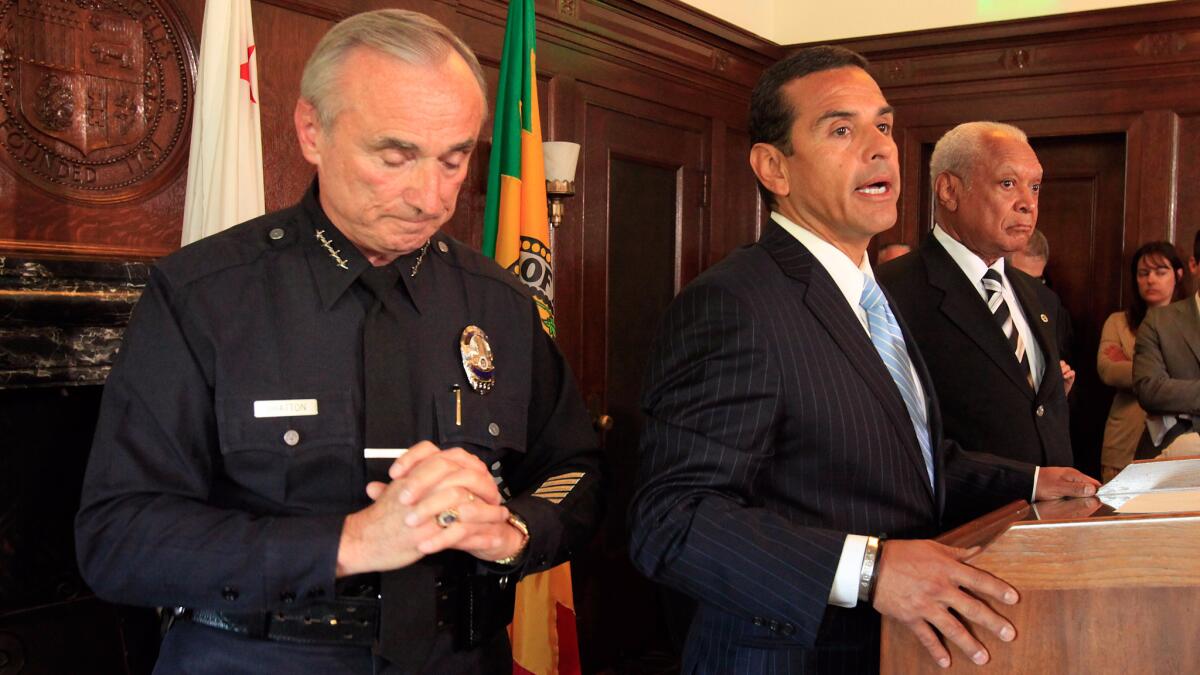 William J. Bratton, left, formally announced his resignation at a press conference at Los Angeles in August 2009 with Mayor Antonio Villaraigosa and police commission vice president John Mack.