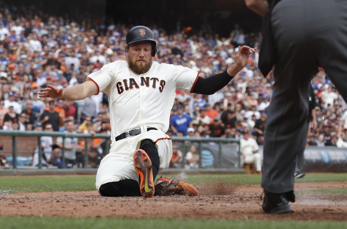 San Francisco Giants' Hunter Pence (8) scores to tie the game against the Los Angeles Dodgers during the fifth inning of a baseball game in San Francisco, Saturday, Sept. 29, 2018. (AP Photo/Jim Gensheimer)