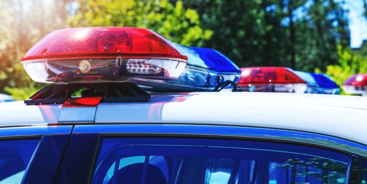 Red and blue lights on top of a police car.