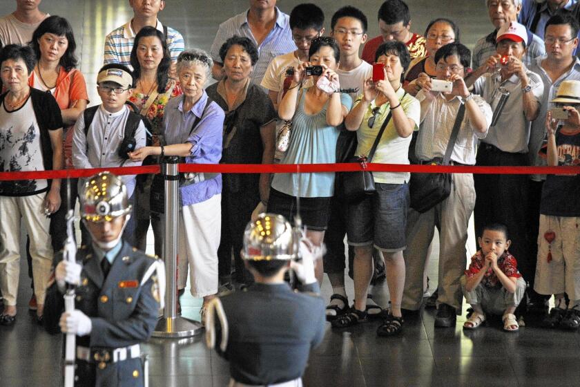 The changing of the guard at the Sun Yat-sen Memorial Hall in Taipei, the Taiwanese capital, is a popular event for tourists from China.