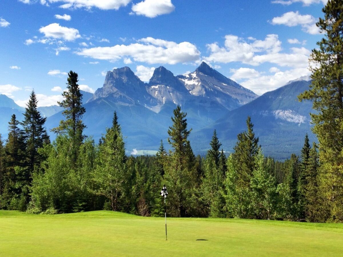 The Three Sisters peaks are the backdrop for the Silvertip Resort in the Canadian Rockies. Tod Leonard