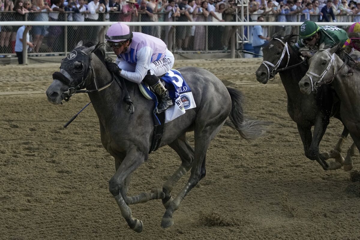 Arcangelo, with jockey Javier Castellano, crosses the finish line to win the 155th running of the Belmont Stakes on Saturday.