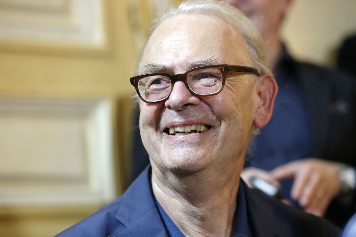 French writer Patrick Modiano speaks to the media on Friday after the announcement of his Nobel Literature Prize earlier in the day.