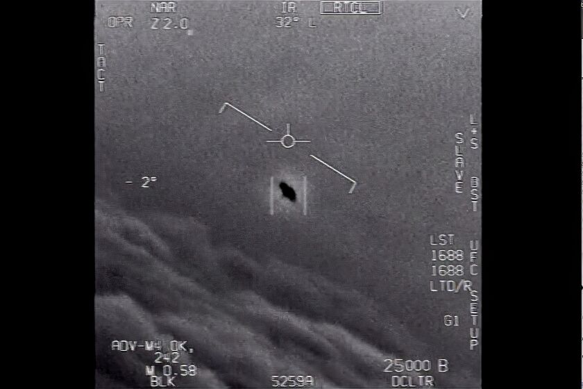 An image taken from a 2015 video of an unexplained object soaring high along the clouds, traveling against the wind. 
