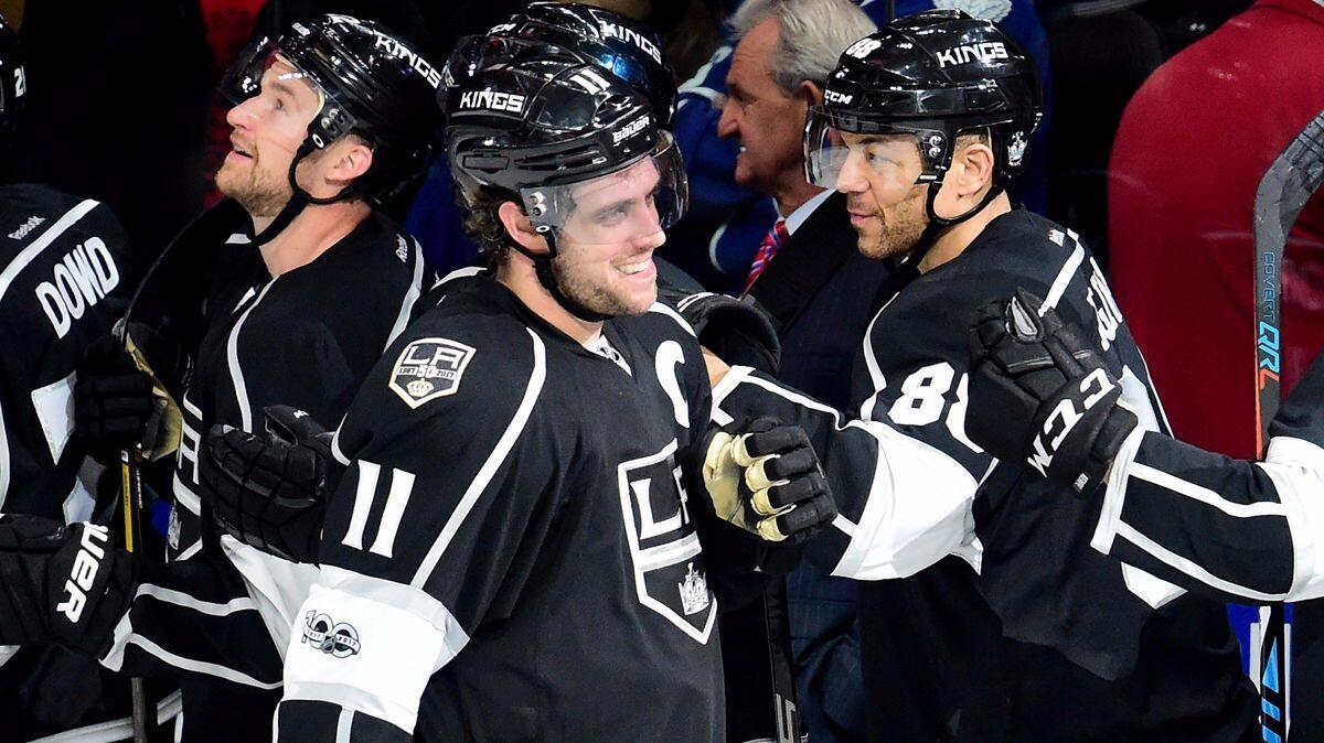 The Kings' Anze Kopitar (11) celebrates his overtime shootout goal with teammate Jarome Iginla (88), part of a 3-2 win over the Toronto Maple Leafs at Staples Center on March 2.
