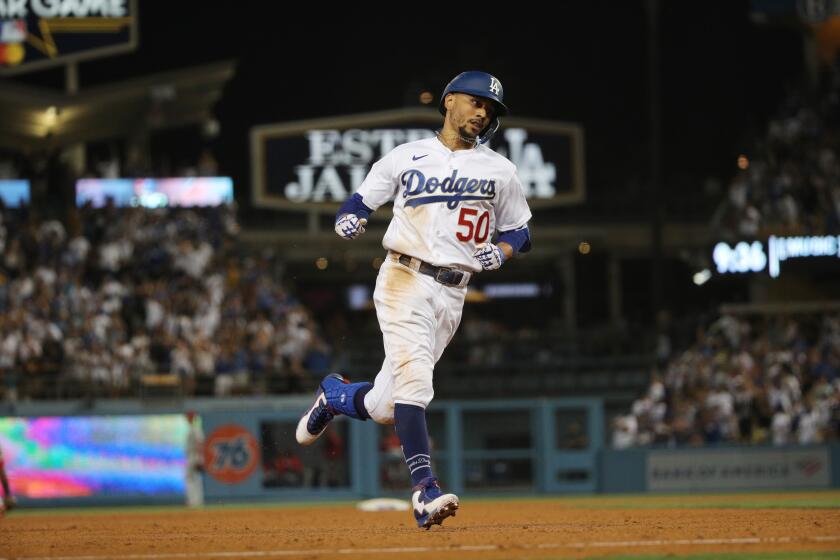 LOS ANGELES, CA - JUNE 15, 2021: a Los Angeles Dodgers right fielder Mookie Betts (50) runs the bases after hitting a solo homer to give the Dodgers a 4-3 lead in the 7th inning against the Phillies on reopening night at Dodger Stadium on June 15, 2021 in Los Angeles, California.(Gina Ferazzi / Los Angeles Times)