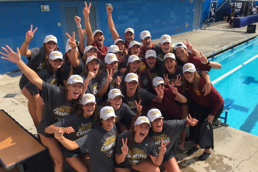 The USC's women's water polo team celebrates after defeating UCLA to win the 2021 NCAA water polo title.