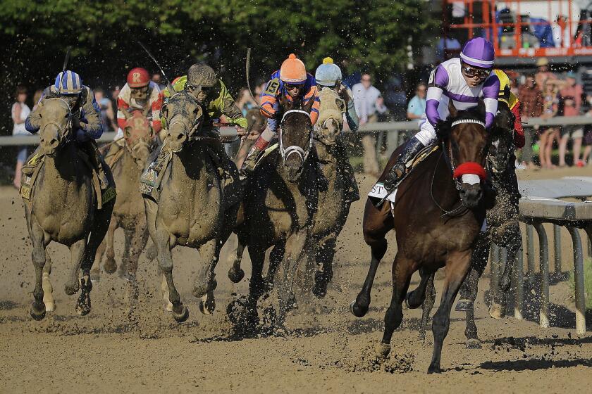 Nyquist, with Mario Gutierrez aboard, pulls away from the field at the top of the homestretch during the 142nd Kentucky Derby.