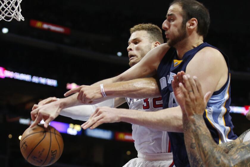 The Clippers' Blake Griffin, left, and Memphis' Kosta Koufos fight for a rebound April 11 during a game at Staples Center.