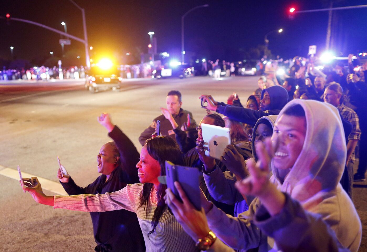 Residents turn out to greet President Obama's motorcade in San Bernardino.