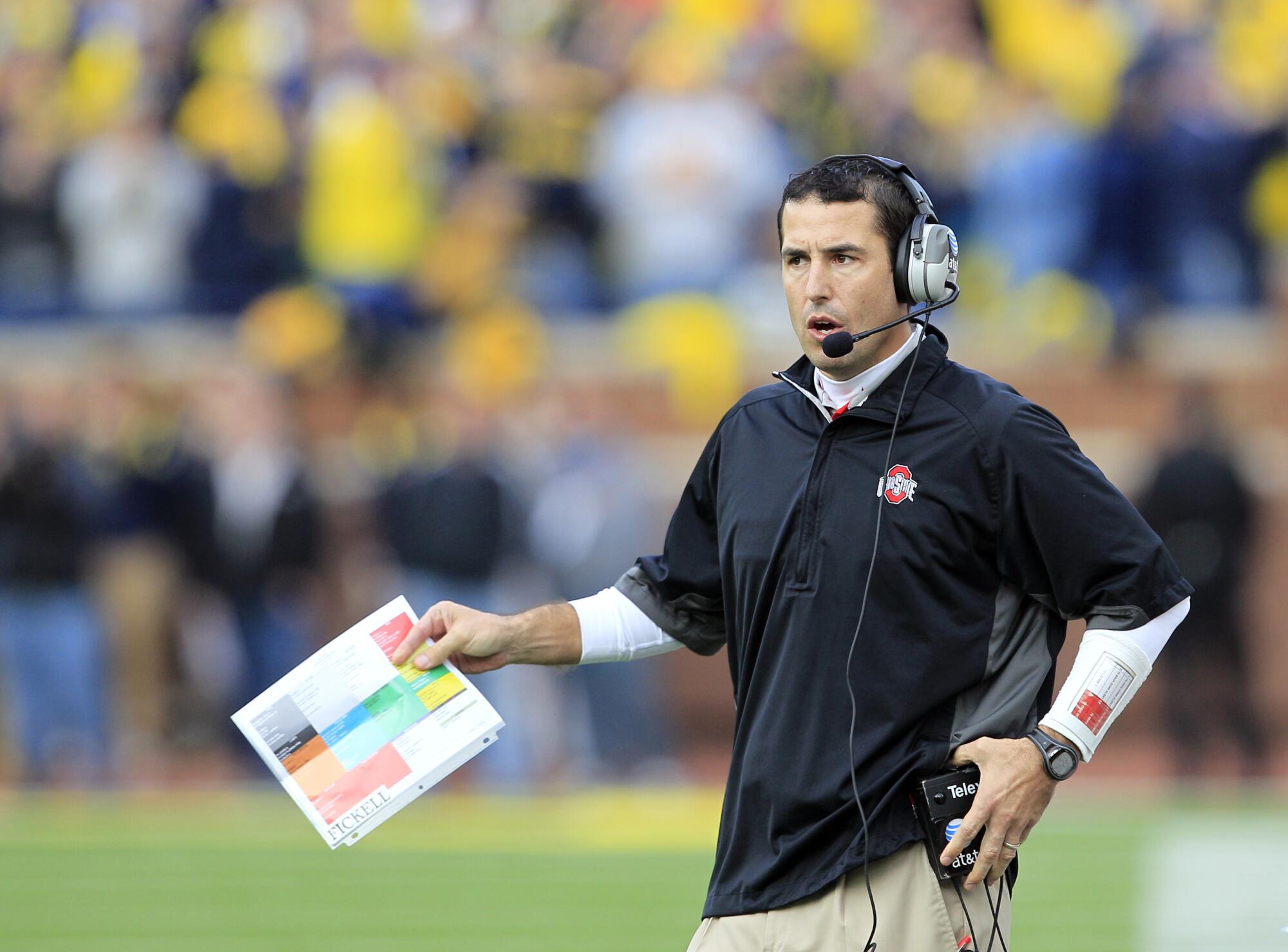 Ohio State coach Luke Fickell watches his team play Michigan on Nov. 26, 2011. 