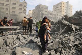 TOPSHOT - Palestinians evacuate the area following an Israeli airstrike on the Sousi mosque in Gaza City on October 9, 2023. Israel continued to battle Hamas fighters on October 9 and massed tens of thousands of troops and heavy armour around the Gaza Strip after vowing a massive blow over the Palestinian militants' surprise attack. (Photo by Mahmud HAMS / AFP) (Photo by MAHMUD HAMS/AFP via Getty Images)