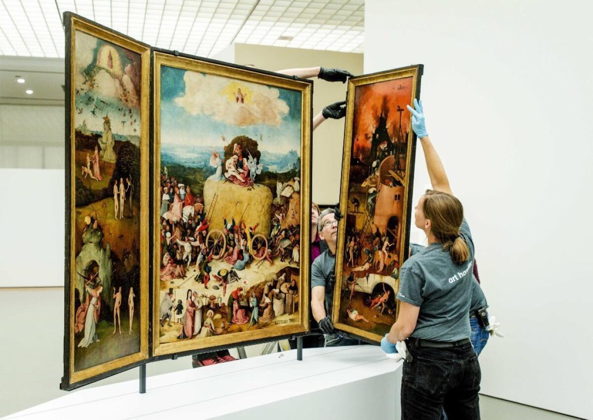 A triptych by Hieronymus Bosch being installed at a museum in Rotterdam recently. The same paintings will be on view in a blockbuster Bosch exhibition next year in a municipal museum in the artist's Dutch hometown of 's-Hertogenbosch.