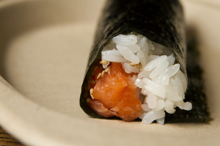 At Kazu Nori, the chef who prepares each hand roll places it directly in front of the customer, who is instructed to eat it immediately.