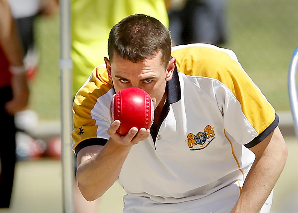 Aaron Sloen, from Northern Ireland, lines up a shot during the U.S. Open of Lawn Bowls at the Newport Harbor Lawn Bowling Club in Corona Del Mar.