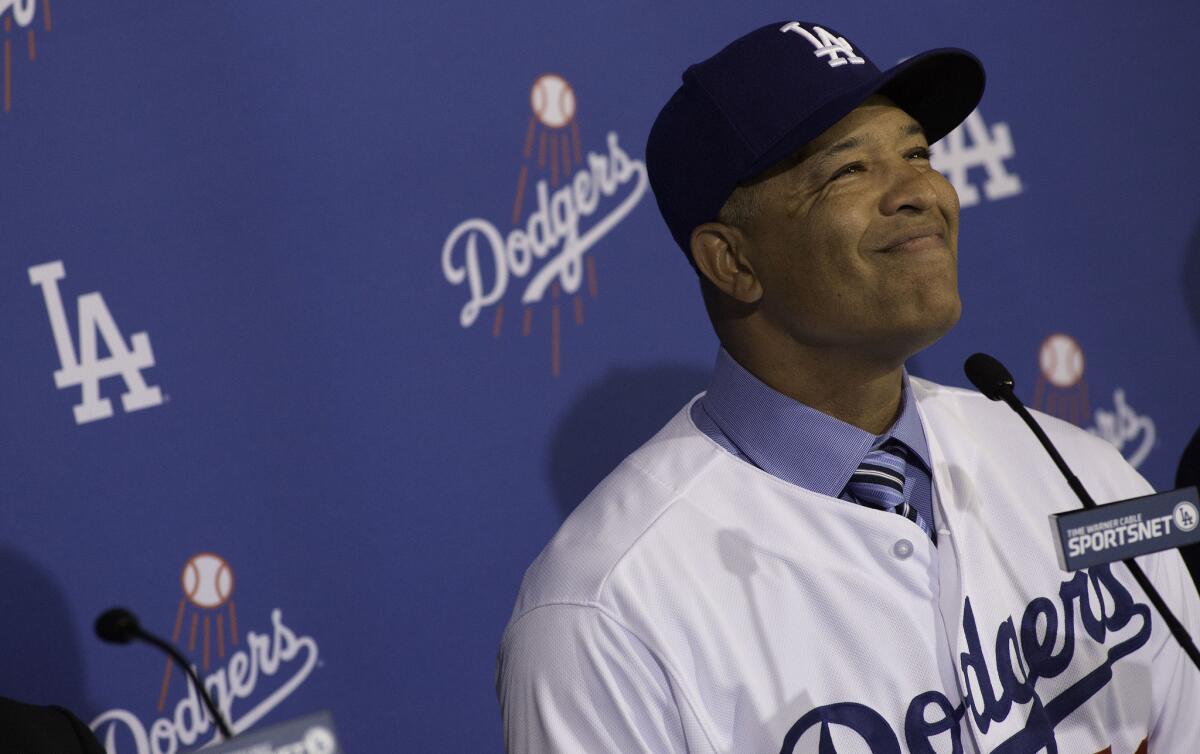 Dave Roberts is introduced as the new Dodgers manager during a news conference at Dodger Stadium.