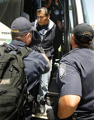 Bus passenger in handcuffs