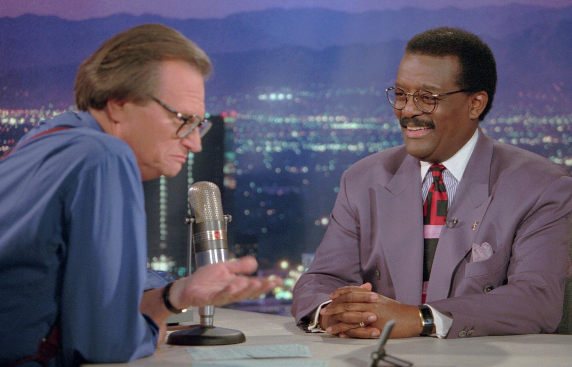 Defense attorney Johnnie Cochran Jr., right, is interviewed by Larry King on "Larry King Live" show on Oct. 4, 1995.