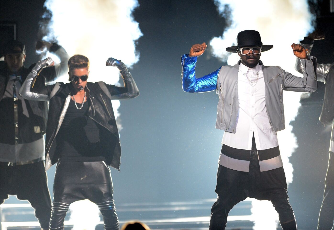 Justin Bieber, left, and Will.i.am perform onstage during the 2013 Billboard Music Awards.