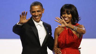 President and Michelle Obama wave to guests after their dance at the inaugural ball in Washington.