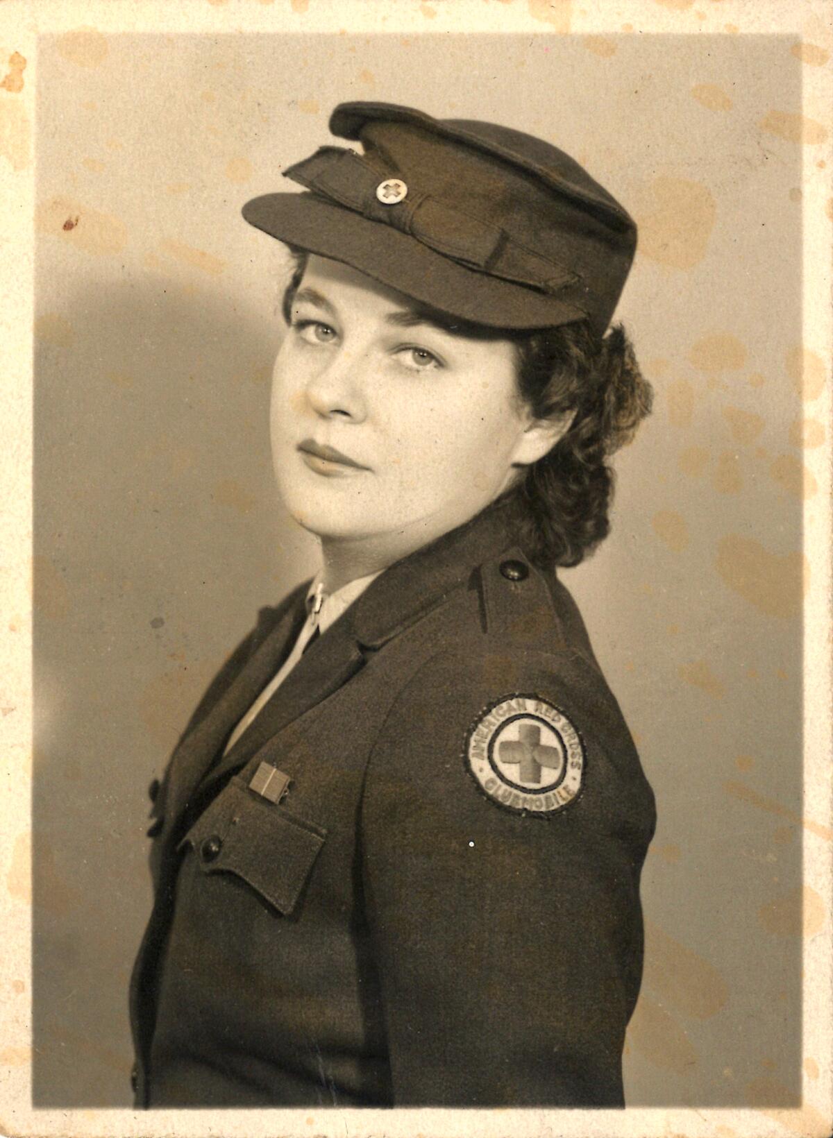 black and white photo of a woman in uniform 