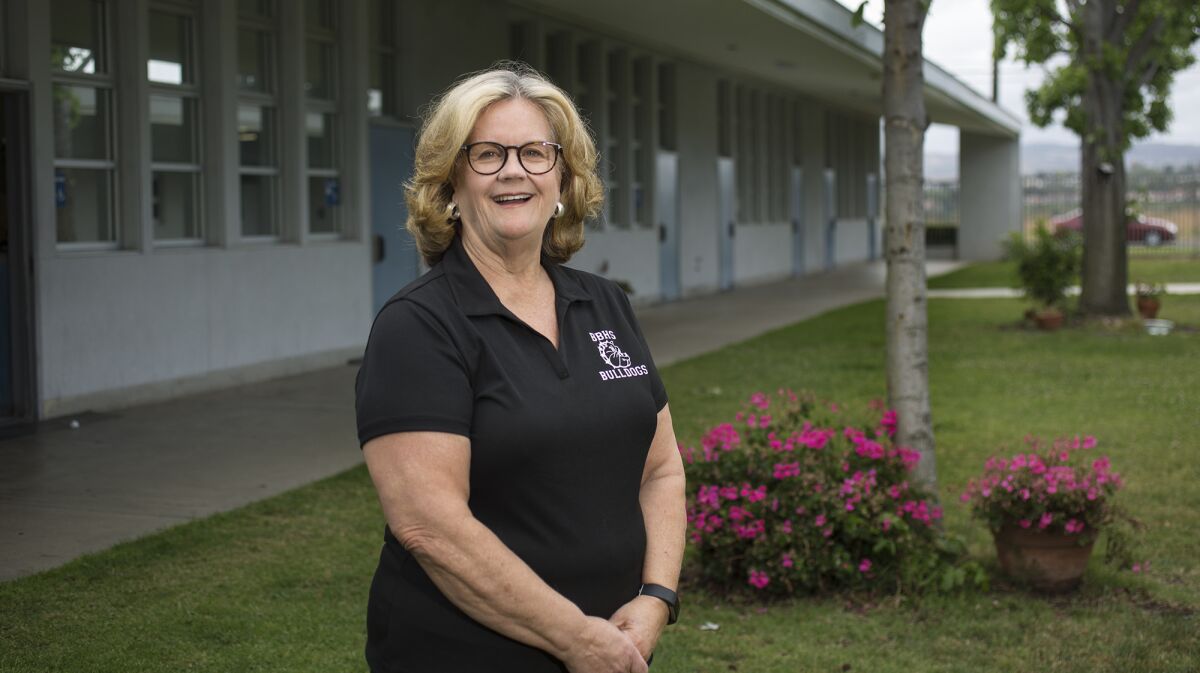 Debbie Davis is retiring after 15 years serving as the principal of Back Bay High School in Costa Mesa. Under her leadership, school hours increased from three to five and graduation and attendance rates have improved.