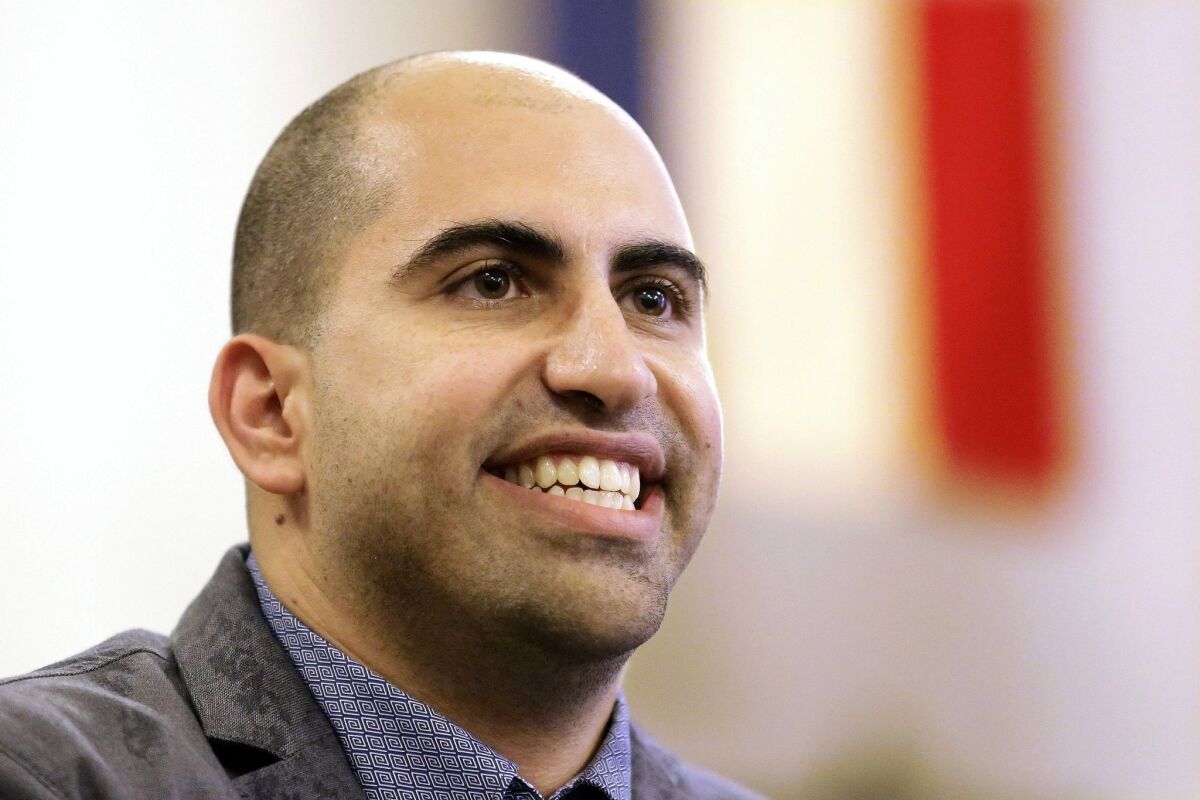One step closer to vindication? Steven Salaita, a professor who lost a job offer from the University of Illinois over anti-Israel Twitter messages, speaks during a news conference in Champaign, Ill., on Sept. 9, 2014.