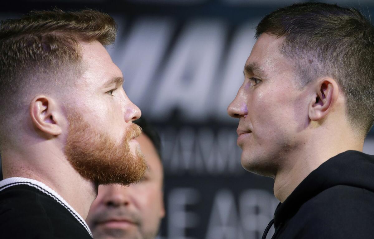 Canelo Alvarez, left, and Gennady Golovkin face off during a news conference on Sept. 13.