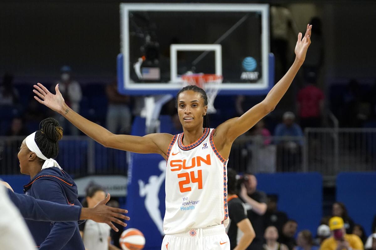 Connecticut Sun's DeWanna Bonner begins to celebrate the team's 72-63 win over the Chicago Sky in Game 5 of a WNBA basketball playoffs semifinal Thursday, Sept. 8, 2022, in Chicago. (AP Photo/Charles Rex Arbogast)