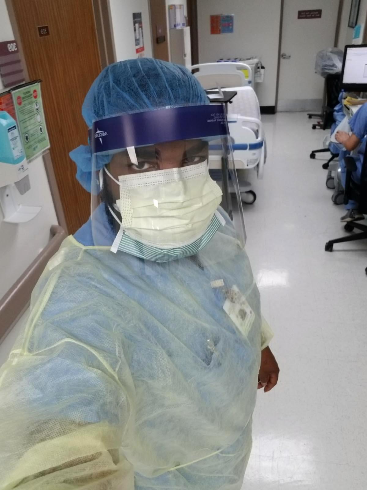 Andre Ross said the only time he is allowed to wear full safety gear — a gown, coverings for his hair and shoes, a face shield — in addition to his surgical mask and gloves is when he disinfects the rooms of possible COVID-19 patients.