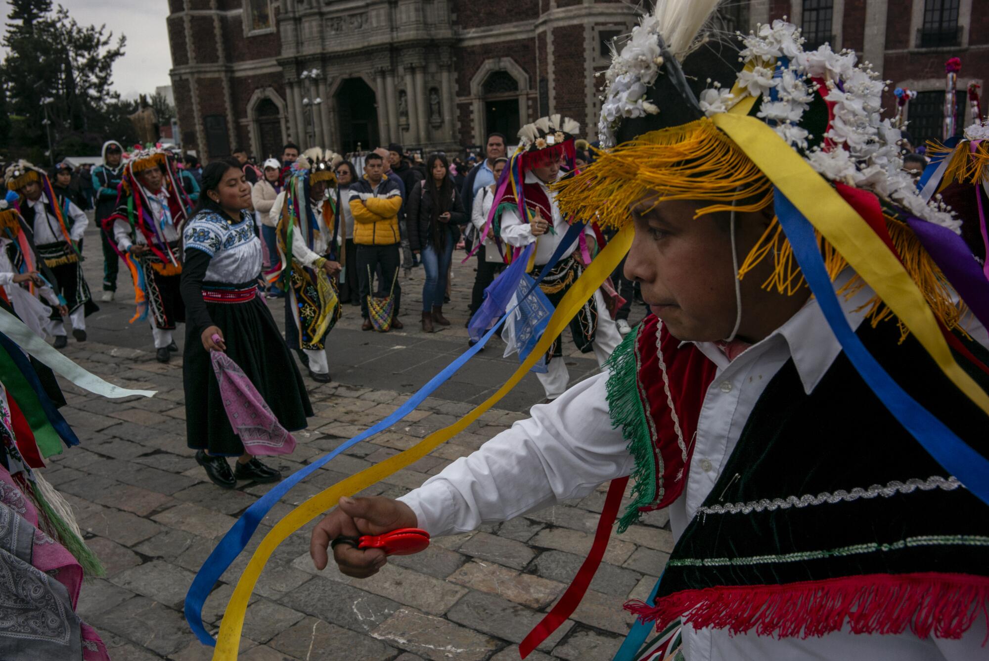 Dancers perform a traditional dance at the Basilica of Guadalupe