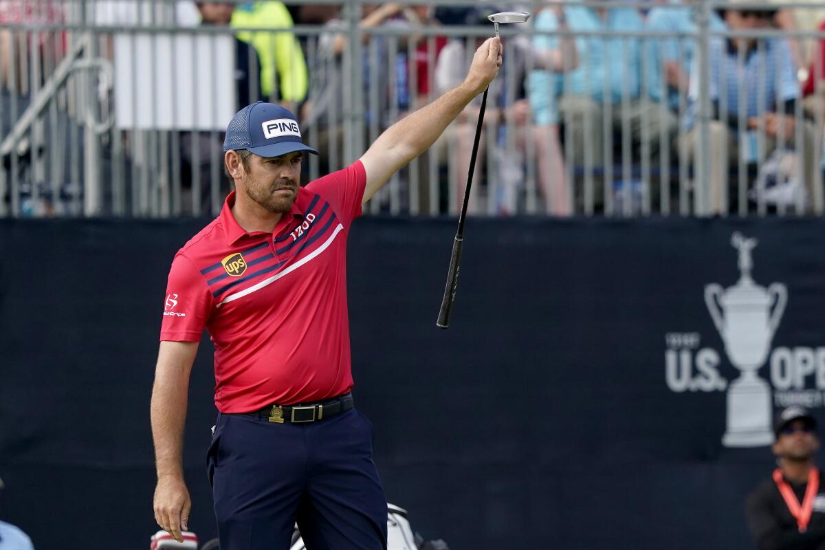 Louis Oosthuizen reacts after making a long eagle putt on No. 18 on June 19, 2021.