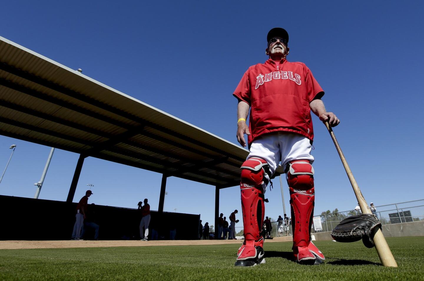 Los Angeles Angels catching coordinator Bill Lachemann, 78, on the field before a spring training baseball game against the Chicago White Sox in Tempe, Ariz.