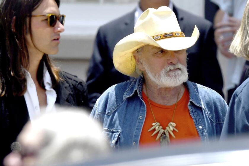 FILE - Dickey Betts, a founding member of the Allman Brothers Band, exits the funeral of Gregg Allman at Snow's Memorial Chapel, June 3, 2017, in Macon, Ga. Guitar legend Betts, who co-founded the Allman Brothers Band and wrote their biggest hit, “Ramblin’ Man,” died Thursday, April 18, 2024. He was 80. (Jason Vorhees/The Macon Telegraph via AP, File)